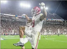  ?? BUTCH DILL – THE ASSOCIATED PRESS ?? Alabama wide receiver John Metchie III celebrates after scoring the winning two-point conversion in the fourth overtime against Auburn.