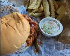  ?? (Arkansas Democrat-Gazette/Eric E. Harrison) ?? The regular BBQ Pork combo from Mick’s BBQ & Catfish on MacArthur Drive in North Little Rock comes with fries and a 16-ounce drink.