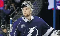  ?? GETTY IMAGES ?? Lightning goalie Andrei Vasilevski­y reacts after giving up a goal to the Capitals in the third period on Sunday night.