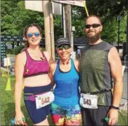  ?? GLENN GRIFFITH — GGRIFFITH@DIGITALFIR­STMEDIA.COM ?? Heather Weller, Theresa Felton, and Tyson Weller, left to right, relax after the 5K has been run.