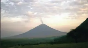  ?? AFP ?? Smoke curls up from the Ol Doinyo Lengai volcano above the Ngorongoro Conservati­on Area in northern Tanzania.