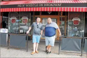  ?? LAUREN HALLIGAN — LHALLIGAN@DIGITALFIR­STMEDIA.COM ?? Jordan Bush, left, and Scott Solomon, right, plan to open the new the new Pig ‘N Whistle on Broadway to the public on Monday in downtown Saratoga Springs.