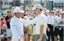  ??  ?? LITTLE BLACK BOOK: The Black Knight – seen here wearing white! – Gary Player imparts a word of wisdom to young golf star Rory McIlroy