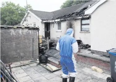  ??  ?? The scene at Glasvey Drive in Dunmurry where a man was rescued by neighbours from a fire