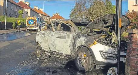  ?? Pictures: Steven Brown. ?? The car rolled down the street and crashed into a bus stop.