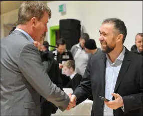  ??  ?? Dundalk FC Manager Stephen Kenny and Chief Executive Mal Brannigan greet each other at the Dundalk FC Owners Group meeting with fans.