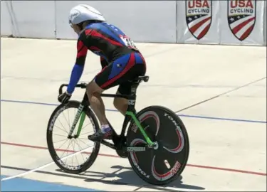  ?? KATHY WATTS VIA AP ?? Carl Grove, a 90-year-old record-setting cyclist, races at the USA Cycling Masters Track Nationals in Breinigsvi­lle, Pa.