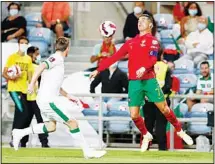  ??  ?? Portugal’s Cristiano Ronaldo (right), controls the ball during the World Cup 2022 group A qualifying soccer match between Portugal and the Republic of Ireland at the Algarve stadium outside Faro, Portugal. (AP)