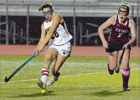  ?? DANA JENSEN/THE DAY ?? Stonington’s Miranda Arruda (20) shoots the ball as East Lyme’s Julia Bates defends and scores the game-winner in sudden death overtime to give the Bears’ a 3-2 win over East Lyme on Thursday nightand at least a share of the ECC regular-season title.