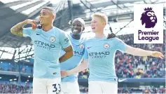  ??  ?? Manchester City’s Brazilian striker Gabriel Jesus (L) celebrates with Manchester City’s French defender Benjamin Mendy and Manchester City’s Belgian midfielder Kevin De Bruyne (R) after scoring their second goal during the English Premier League...