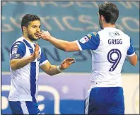  ??  ?? FIRST BLOOD: Will Grigg congratula­tes Morsy