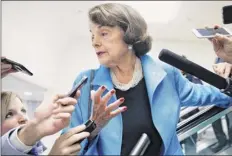  ?? Jacquelyn martin / Associated Press ?? Sen. dianne feinstein, d-calif., is surrounded by reporters as she arrives for a vote earlier this month on Capitol Hill in Washington. She called Sunday night for the “immediate postponeme­nt” of any further action on Kavanaugh’s nomination.