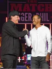  ?? ETHAN MILLER / GETTY IMAGES ?? Phil Mickelson and Tiger Woods played a not-so-memorable match against each other after Thanksgivi­ng. Woods won the Tour Championsh­ip in 2018, his first win since 2013. Mickelson’s 2018 will be remembered for hitting a moving ball at the U.S. Open.