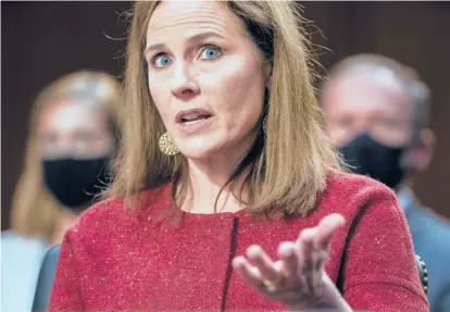  ?? JIM LO SCALZO/GETTY ?? Supreme Court nominee Judge Amy Coney Barrett testifies before the Senate Judiciary Committee on the second day of her Supreme Court confirmati­on hearing on Tuesday on Capitol Hill.