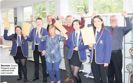  ??  ?? Success Queen Margaret pupils celebrate their exam results