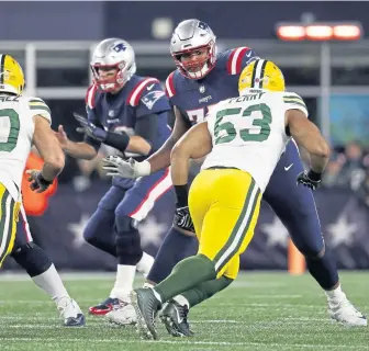  ?? ASSOCIATED PRESS ?? PROTECTION POLICY: Left tackle Trent Brown blocks for Tom Brady during the Pats’ win against the Packers last Sunday night.