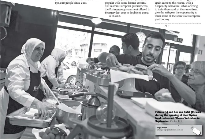  ?? Photo: AFP ?? Fatima (L) and her son Rafat (R) work during the opening of their Syrian food restaurant ‘Mezze’ in Lisbon in September.