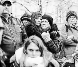  ?? JEAN-FRANÇOIS BADIAS
THE ASSOCIATED PRESS ?? Residents react during a gathering being held in a central square of the eastern French city of Strasbourg on Sunday to pay homage to the victims of a gunman who killed five people and wounded a dozen more. The gathering was held in Kleber Square by a Christmas market and near where the gunman opened fire last Tuesday evening.