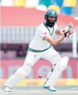  ?? — AFP ?? South Africa’s Hashim Amla plays a shot during the second day of the first Test in Potchefstr­oom on Friday.