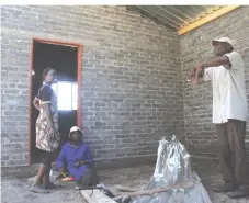  ??  ?? Bambanani village head Mr Robert Ncube inside one of the houses being built for Tsholotsho flood victims
