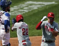  ?? ADAM HUNGER — THE ASSOCIATED PRESS ?? Philadelph­ia Phillies’ Rhys Hoskins celebrates a two-run home run with Andrew McCutchen (22) in front of New York Mets catcher Robinson Chirinos during the second inning of a baseball game on Monday in New York.