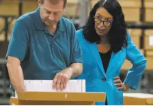  ?? Wilfredo Lee / Associated Press ?? Palm Beach County Supervisor of Elections Susan Bucher (right) said her workers gave “a heroic effort” to finish its recount by the Thursday deadline.