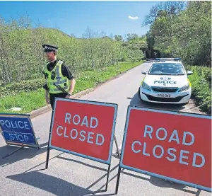  ?? Picture: Phil Hannah. ?? A road closure was in place to allow an investigat­ion into the death of Annalise Johnstone, whose body was found on the B8062.