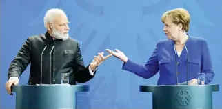  ??  ?? German Chancellor Angela Merkel with Indian Prime Minister Narendra Modi at a press conference in Berlin on Tuesday. (AFP)