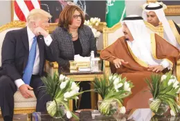  ??  ?? 1ST FOREIGN TRIP – United States President Donald Trump (left) talks with Saudi King Salman after a welcome ceremony at the Royal Terminal of King Khalid Internatio­nal Airport, Saturday, in Riyadh, Saudi Arabia. Trump’s trip to Saudi Arabia is aimed at...