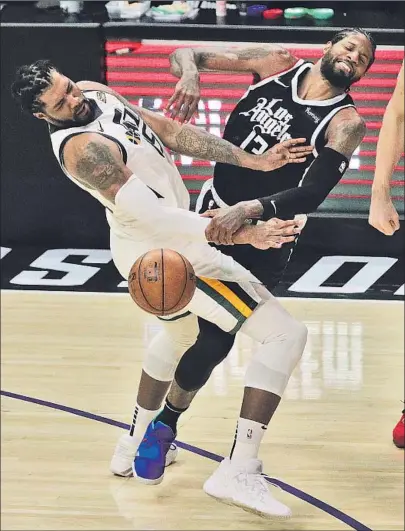  ?? Gina Ferazzi Los Angeles Times ?? PAUL GEORGE, right, fouled by Utah center Derrick Favors, scored 31 points for his first 30-point game since April 23.