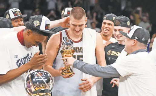  ?? KIRBY LEE/USA TODAY SPORTS ?? Nuggets center Nikola Jokic celebrates winning the Western Conference MVP trophy and beating the Lakers.