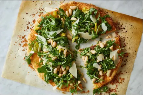  ?? BRYAN GARDNER — THE NEW YORK TIMES ?? Salad Pizza With White Beans and Parmesan.