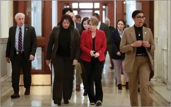  ?? NANCY LANE — BOSTON HERALD ?? Gov. Maura Healey leads Lt. Gov. Kim Driscoll to the corner office after speaking to the media at the State House earlier this month.