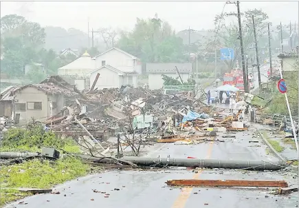  ?? Picture: REUTERS ?? Destroyed houses, cars and power poles which according to local media were believed to be caused by a tornado, are seen as Typhoon Hagibis approaches the Tokyo area in Ichihara, east of Tokyo, Japan.