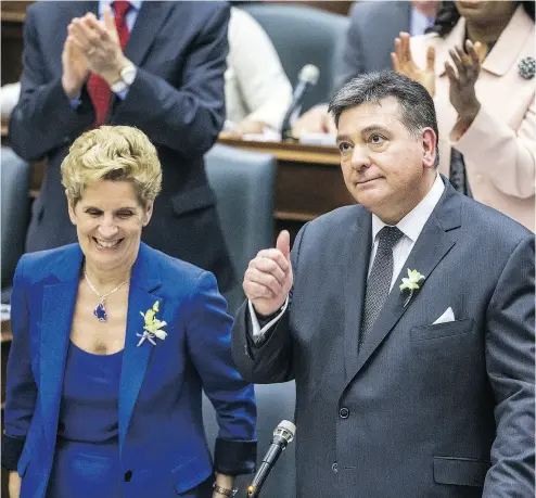  ?? ERNEST DOROSZUK / POSTMEDIA NEWS ?? Ontario Finance Minister Charles Sousa delivers the provincial budget Wednesday as Premier Kathleen Wynne looks on. The Liberals’ eve- of- election budget smacks of an addiction to spending, Kelly McParland writes.