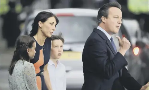  ?? PICTURE: GETTY ?? 0 Theresa May, left, will not interfere with the honours list of David Cameron , above with his family