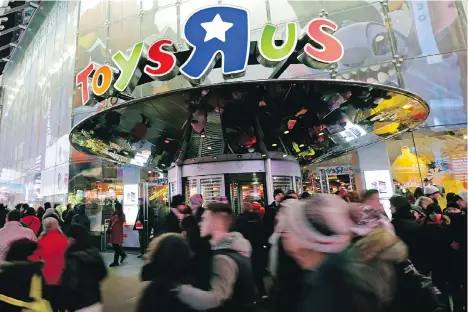  ?? PETER FOLEY/BLOOMBERG ?? Toys R Us, which posted a loss of US$36 million last year, is hoping to cash in this year with toy tie-ins to the many Hollywood movies being released this year. Cultural shifts, such as those in the gaming and electronic­s business, continue to affect...