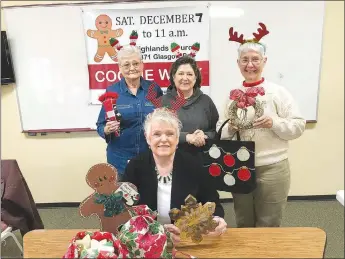  ?? Becca Martin-Brown/NWA Democrat-Gazette ?? Jean Galloway (seated, front), Suzanne Evans, Nancy Johnson and Pat Lehman (standing, from left) pause during a Cookie Walk work day to promote the Dec. 7 event. The Cookie Walk is now in its 31st year at Highlands United Methodist Church in Bella Vista.