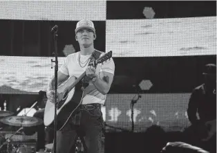  ?? Yi-Chin Lee / Staff photograph­er ?? Parker McCollum performs at the Houston Livestock Show and Rodeo at NRG Stadium on Saturday, less than a week after his Academy of Country Music win for new male artist.