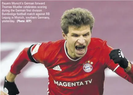  ?? (Photo: AFP) ?? Bayern Munich’s German forward Thomas Mueller celebrates scoring during the German first division Bundesliga football match against RB Leipzig in Munich, southern Germany, yesterday.