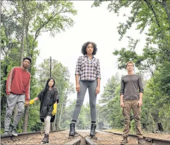  ?? AP PHOTO ?? This image released by Twentieth Century Fox shows, from left, Skylan Brooks, Miya Cech, Amandla Stenberg and Harris Dickinson in a scene from “The Darkest Minds.”