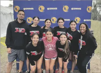  ?? COURTESY PHOTO ?? The Imperial Tigers’ Girls’ Cross Country team and coaches Athena Nuno (far right) and Assistant Coach Victor Nuno (far left) pose for a photo after the team competed in the CIF State Cross Country Championsh­ip Meet, Saturday, Nov. 26, in Fresno, California.