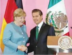  ?? — Reuters ?? Germany’s Chancellor Angela Merkel with Mexico’s President Enrique Pena Nieto after attending the news conference at National Palace in Mexico City.