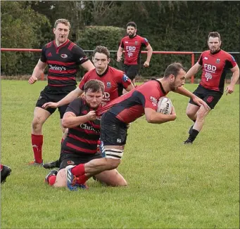  ??  ?? Arklow’s Gavin Cox wasn’t letting go of his man during the Leinster League Division 2B clash.