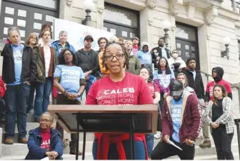  ?? STAFF PHOTO BY ROBIN RUDD ?? Nikki Lake, of Chattanoog­ans in Action for Love, Equality & Benevolenc­e, speaks during the event. CALEB held a news conference Thursday on the Chattanoog­a City Hall steps to offer a public response to the city’s housing action plan, which Mayor Tim Kelly released in August.