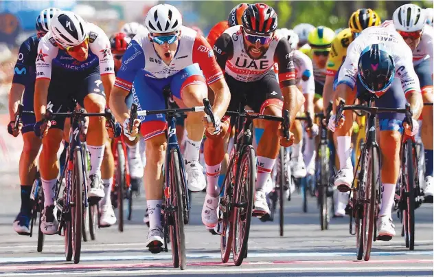  ?? Agence France-presse ?? ↑ Team Groupama-fdj’s Arnaud Demare (second left) crosses the finish line to win the fifth stage of the Giro d’italia.