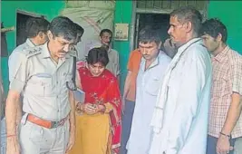  ??  ?? Police and forensic experts collecting evidence from the house of the deceased girl at Behbal village in Rohtak district on Sunday. MANOJ DHAKA/HT