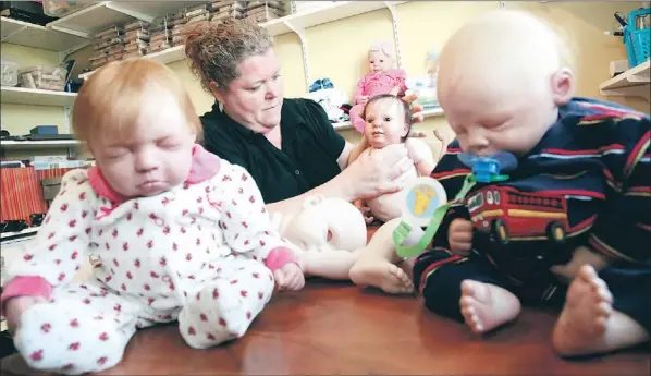  ?? — Photo by Rhonda Hayward/the Telegram ?? Colleen Feaver with some of the dolls she has made.