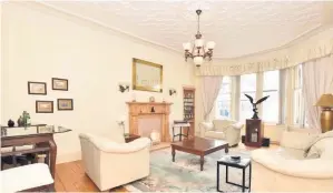  ??  ?? Stylish lounging Formal room extends to 28 feet