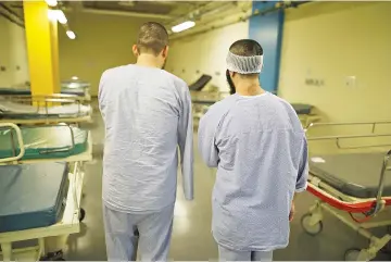  ??  ?? Syrian patients, who were wounded in the ongoing violence in Syria, stand in a hospital ward at the Galilee Medical Center where they are receiving treatment on Oct 26.